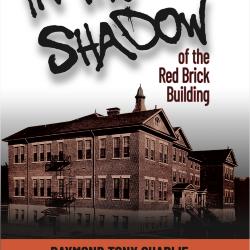 In the shadow of the red brick building