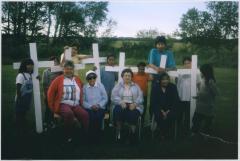 Placing cross for residential school children.  Elders: Rosabelle McNabb, Jessie Dieter, Sarah Brass, Shirley Akapew.  Children: Tanis, Terry, Cody, Deidre, Gena, Joe, Dakota, Jason