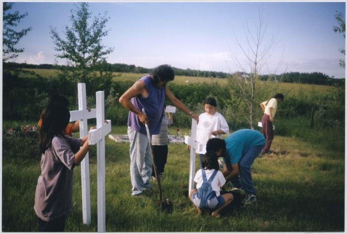 Placing the crosses in Wanakapew United Church cemetery
