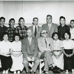 [A group of students with government and school officials]