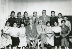 [A group of students with government and school officials]