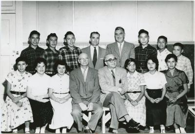 [A group of students with government and school officials]