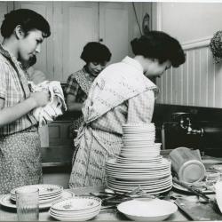 [Female students washing the dishes]