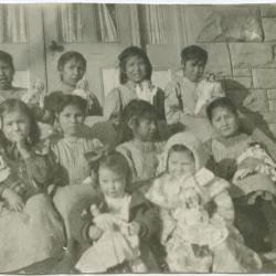 [Young pupils of the Red Deer Institute : each girl has a doll which came as presents from the east]