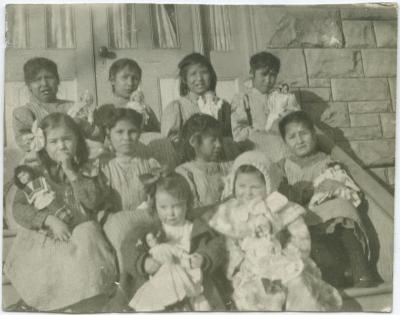 [Young pupils of the Red Deer Institute : each girl has a doll which came as presents from the east]