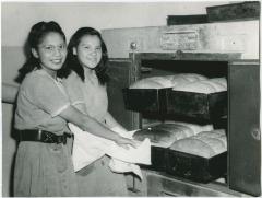 [Female students baking bread]