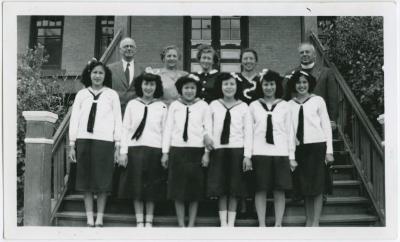 [Mr. Lachlan McLean, Mrs. C.M. Loveys, Mrs. McLean, and Miss Ila Brown with some C.G.I.T. girls, File Hills Residential School, Sask.]