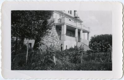A view of the residence with the cairn, Round Lake Residential School, Sask.
