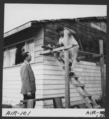 Alberni Indian Residence Alberni, B. C. Rev. F. E. "Ed" Kempling visiting local resident. Indian man, Jimmy Gallic.