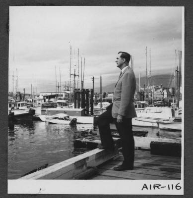 Alberni Indian Residence Alberni, B. C. The Rev. F. E. "Ed" Kempling at the port, looking at fishing boats.