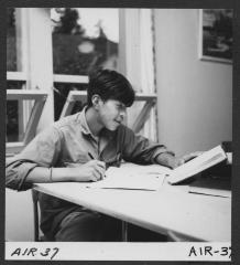 Alberni Indian Residence Alberni, B. C. Boy at homework in study room.