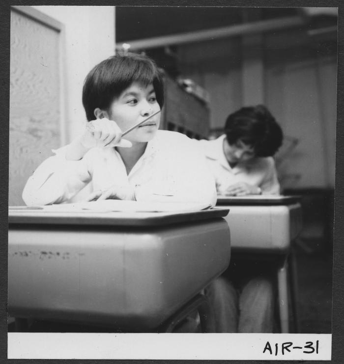 Alberni Indian Residence Alberni, B. C. Girl at desk in study room. Each grade level has its own room for study.