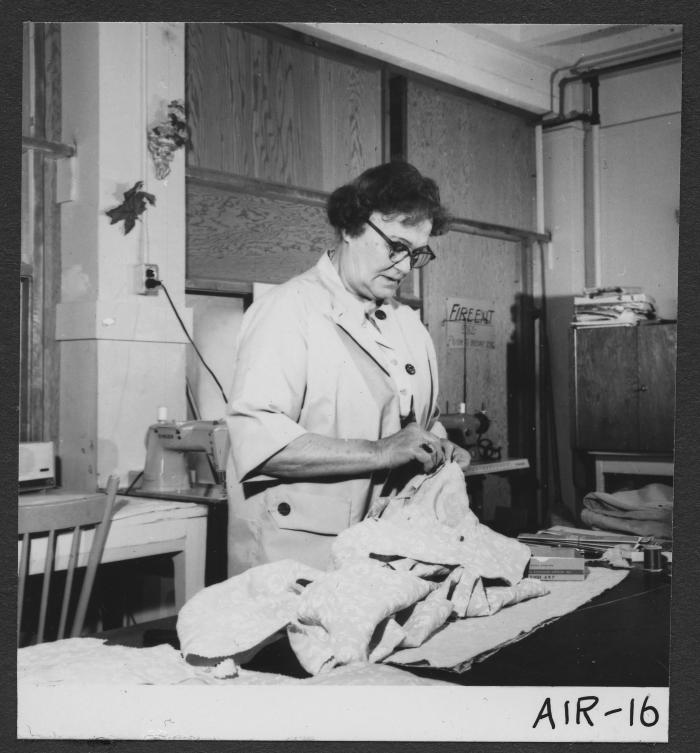 Alberni Indian Residence Alberni, B. C. Member of sewing-room staff at work.