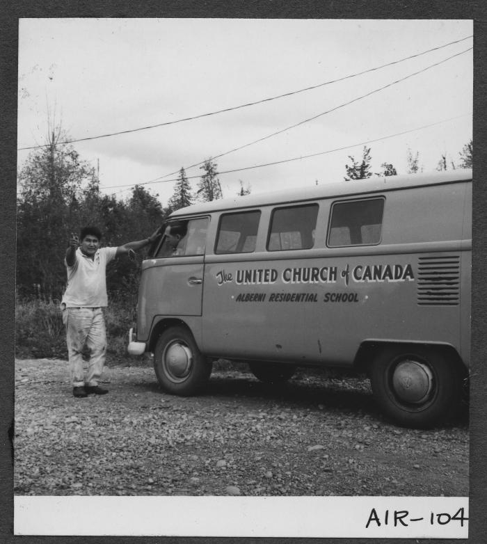 Alberni Indian Residence Alberni, B. C. Mr. Jimmy Gallic, a local resident stands beside Residence Bus.