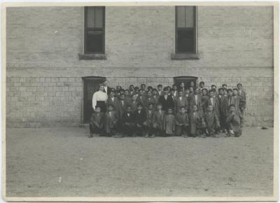 Boys with some of the staff at the Mount Elgin Indian Industrial Institute, Muncey