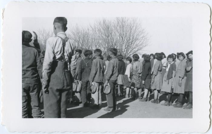 Indian children at flag raising at beginning of every school day, Round Lake, Sask.
