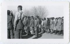 Indian children at flag raising at beginning of every school day, Round Lake, Sask.