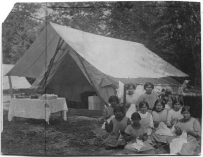 Girls of the Elizabeth Long Memorial Home sewing at camp