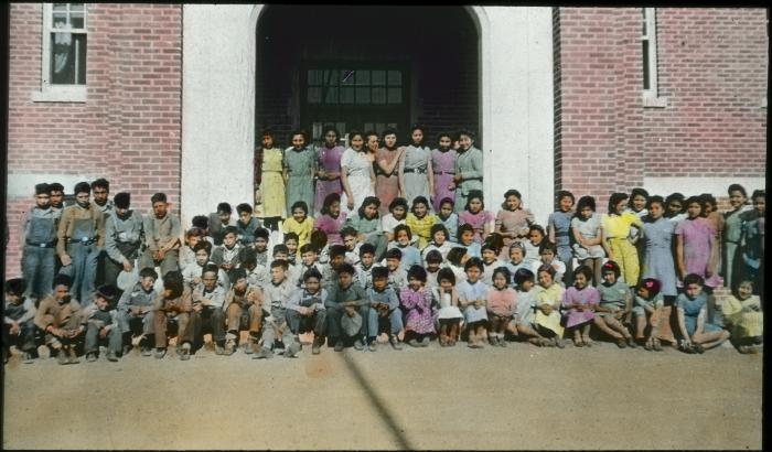 Pupils in front of Brandon Residential School, Man.