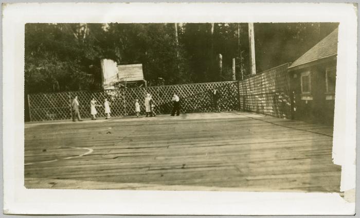 Plank playground and basketball court built by W.M.S. [Woman's Missionary Society]