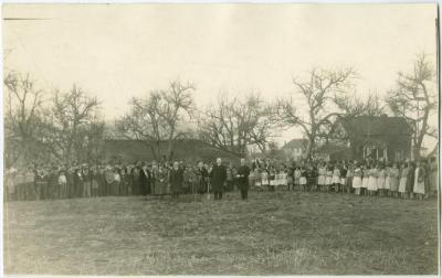 Moderator Right Rev. T. A. Moore plants a tree at the Coqualeetza Residential School