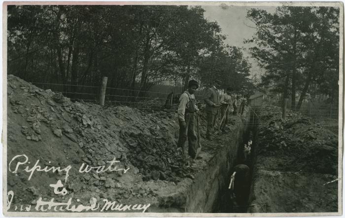 Students digging trenches for water pipes at the Mount Elgin Indian Industrial Institute, Muncey