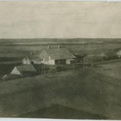 The farm buildings and some of the fields ready for seeding