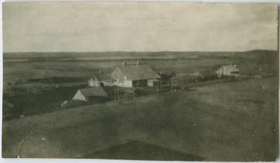 The farm buildings and some of the fields ready for seeding