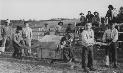 Young boys playing "Stampede" in Morley, Alberta