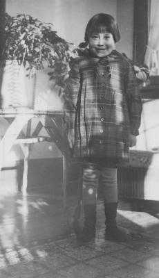 Young girl by note table at Morley Residential School