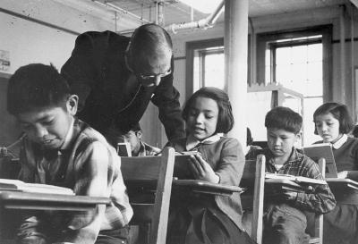 Bishop Dean in the classroom with students at St. George's, Lytton