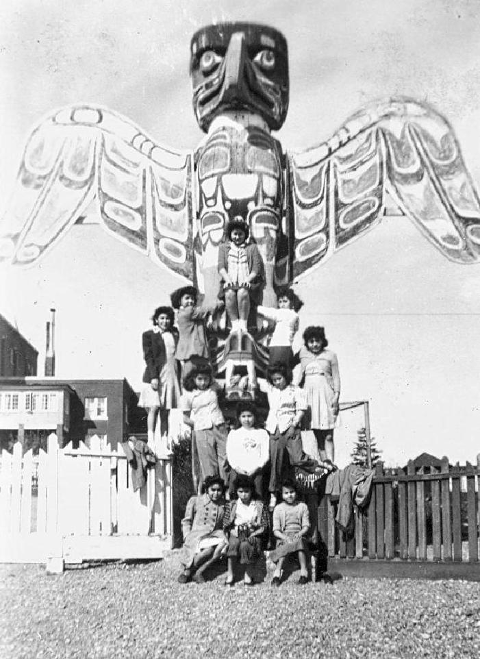 Students and Totem pole at St. Michael's School, Alert Bay