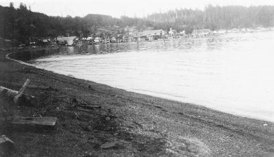 Alert Bay Village from beach near St. Michael's Boys' School (sawmill and church in centre)