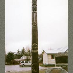 Totem with story of Indian Residential Schools