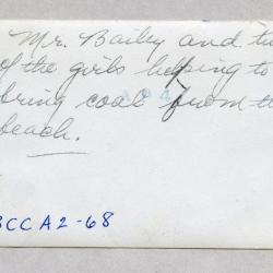 Mr. Bailey and two of the girls helping to bring coals from the beach