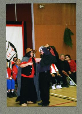 James Amos receiving headband and vest