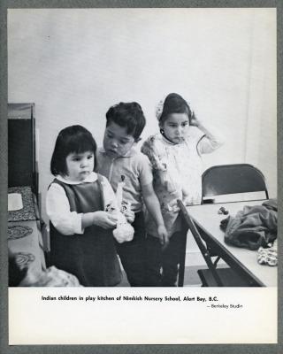 Indian children in play kitchen of Nimkish Nursery School, Alert Bay, B.C.