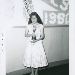 [Graduating student, Ruth Fiddler of Island Lake holding an award, Norway House Indian Residential School]