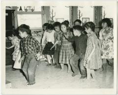 [Children performing a song with actions, Norway House Indian Residential School, Man.]
