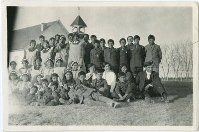 [Rev. Denyes and pupils from the Indian Boarding School assembled outside Norway House Methodist Church]