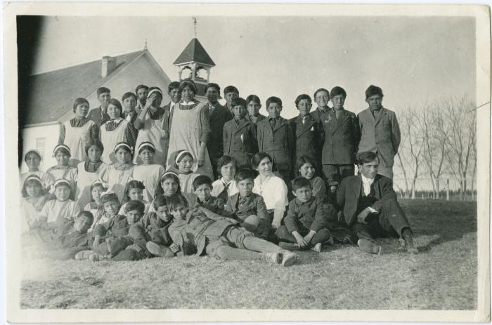 [Rev. Denyes and pupils from the Indian Boarding School assembled outside Norway House Methodist Church]