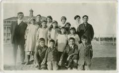 [Rev. Denyes with children from Cross Lake who attend the Indian Boarding School at Norway House]