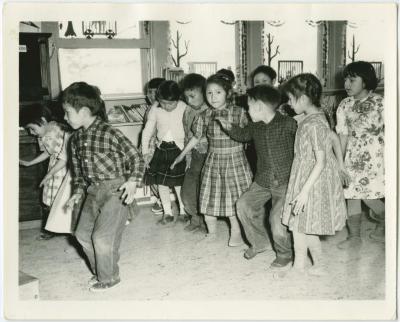 [Children performing a song with actions, Norway House Indian Residential School, Man.]