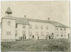 [Staff and students assembled outside the Indian Boarding School at Norway House]