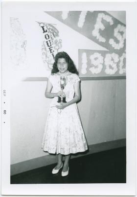 [Graduating student, Ruth Fiddler of Island Lake holding an award, Norway House Indian Residential School]