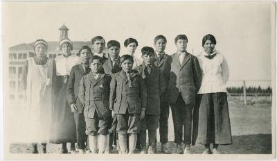 [Rev. Denyes with children from Island Lake who attend Norway House Indian Boarding School]