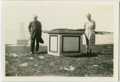 Rev. and Mrs. Gaudin standing beside the James Evans pulpit, Norway House