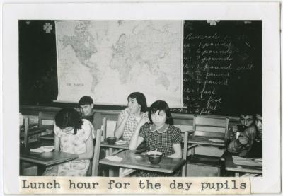[Day pupils eating lunch, Norway House Indian Residential School]