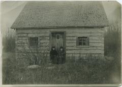 Norway House jail on Jail Island : two government nurses sitting on steps