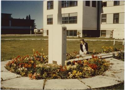 Flag pole base. Day School block at left.